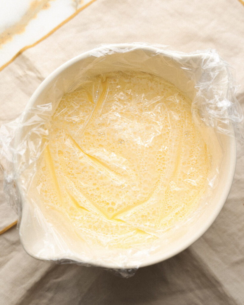 Butter ice cream custard with cling wrap.