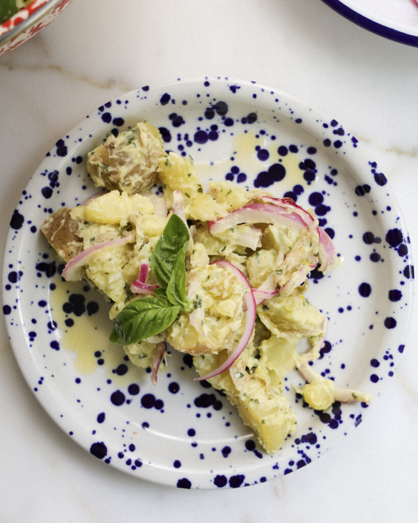 Basil potato salad served on a plate.