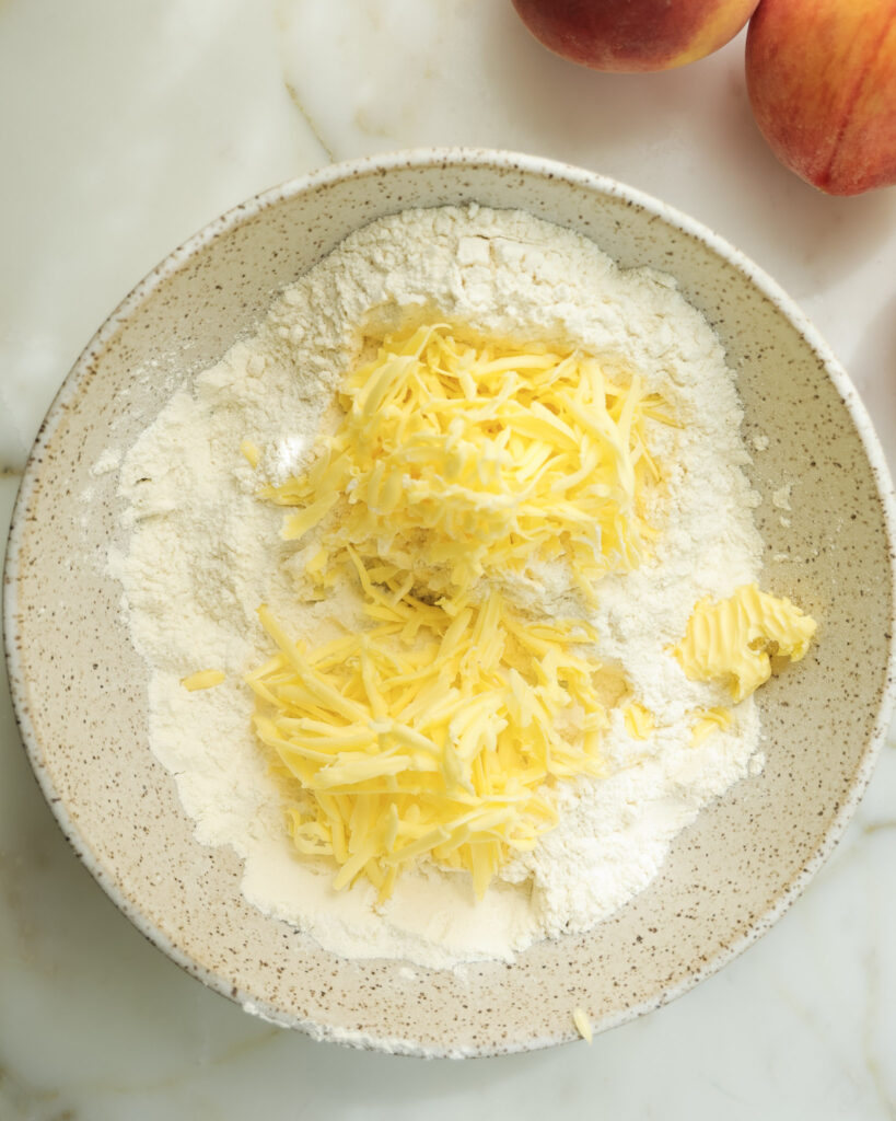 Grated butter added to dry ingredients.