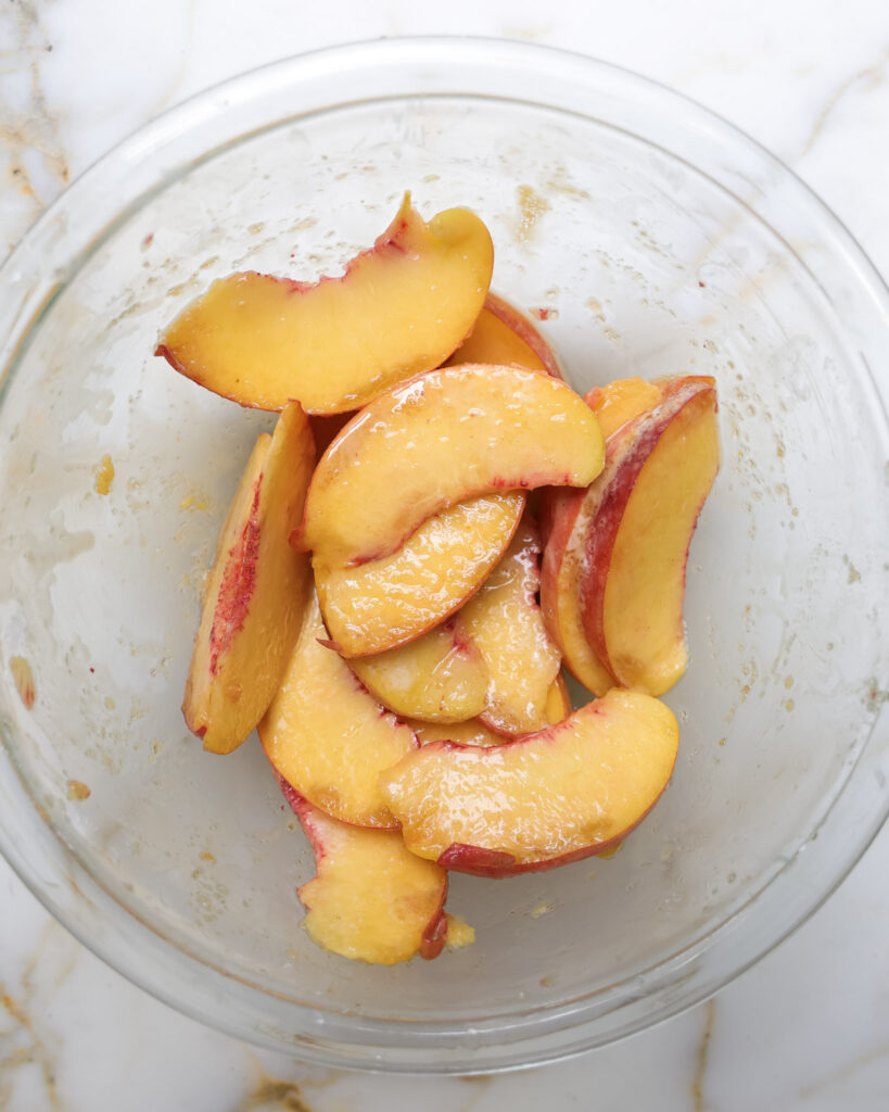 Peaches tossed in lemon juice, cornstarch, and brown sugar.